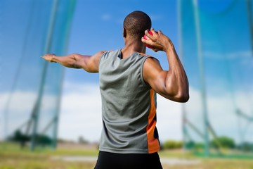 athletic man preparing the shot put
