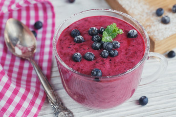 Delicious bilberry smoothie with fresh berries. Fresh yogurt wit