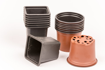 Black and orange plastic flower pots