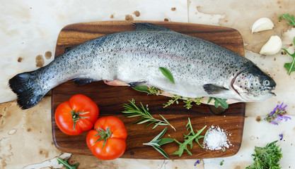 fresh rainbow trout on the cutting board ready to cook