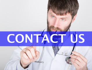 technology, internet and networking in medicine concept - medical doctor presses contact us button on virtual screens. Internet technologies in medicine and tourism