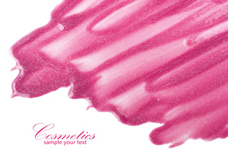 Lip gloss sample isolated on white. It can be used as a background.