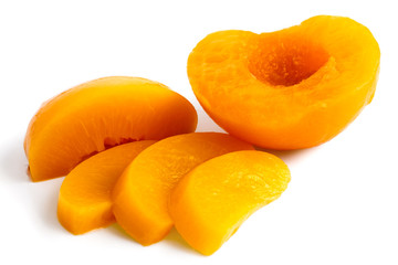 Peach half and slices isolated on white background.