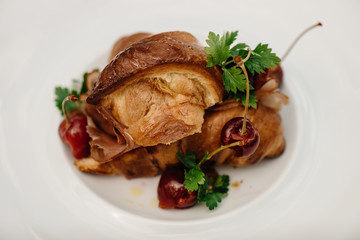 Home made ham with croissant and vinegar cherries