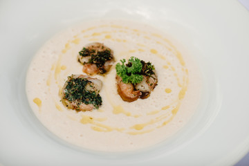 Potato creme soup with salmon and shrimps