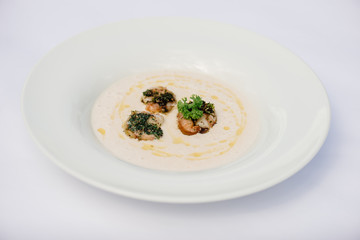 Potato creme soup with salmon and shrimps