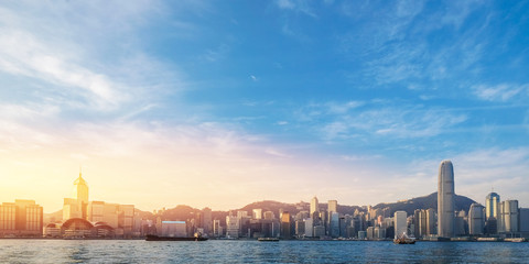 Hong Kong's Victoria Harbour in sunrise with text welcome to Hon