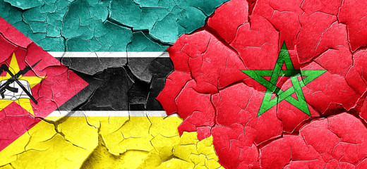 Mozambique flag with Morocco flag on a grunge cracked wall