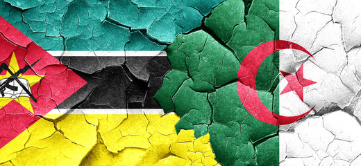 Mozambique flag with Algeria flag on a grunge cracked wall