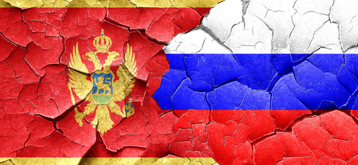 Montenegro flag with Russia flag on a grunge cracked wall