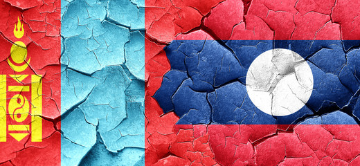 Mongolia flag with Laos flag on a grunge cracked wall