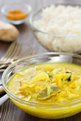 cod fish curry in bowl and boiled rice