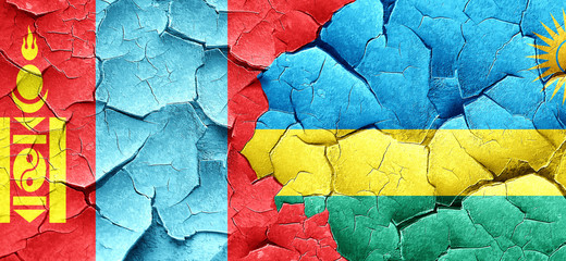 Mongolia flag with rwanda flag on a grunge cracked wall