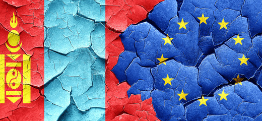 Mongolia flag with european union flag on a grunge cracked wall