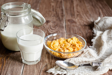 Breakfast with corn flakes and milk in rural style