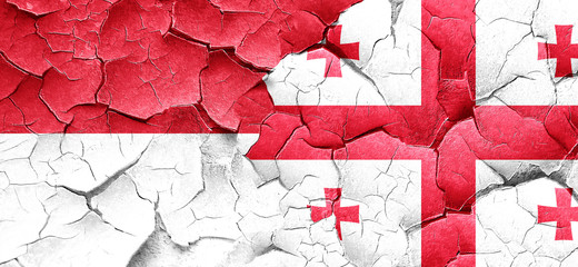 monaco flag with Georgia flag on a grunge cracked wall