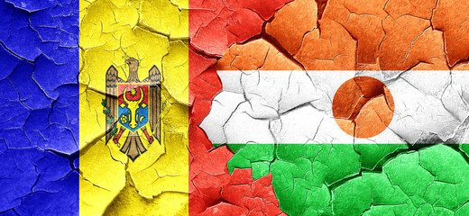 Moldova flag with Niger flag on a grunge cracked wall