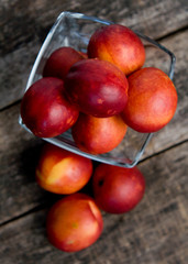 The simple food composition with nectarines on the unique backing closeup 