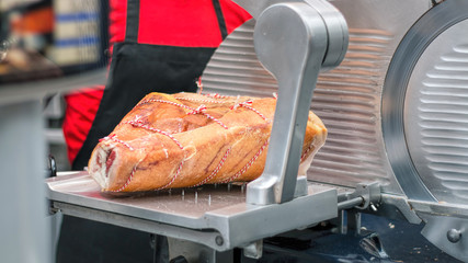 Leg Of Prosciutto Ham. Gourmet Meat Deli, Meat Slicer. - obrazy, fototapety, plakaty