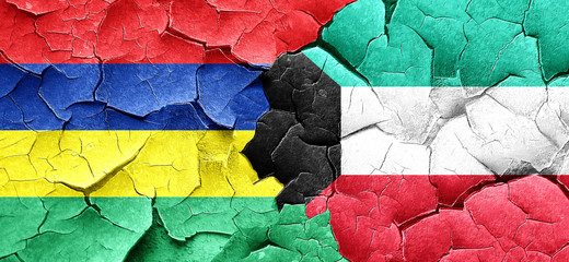 Mauritius flag with Kuwait flag on a grunge cracked wall
