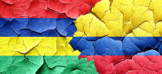 Mauritius flag with Colombia flag on a grunge cracked wall