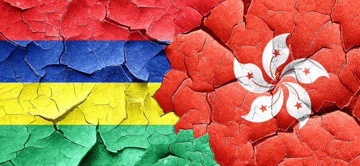 Mauritius flag with Hong Kong flag on a grunge cracked wall
