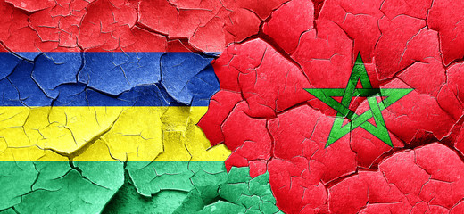 Mauritius flag with Morocco flag on a grunge cracked wall