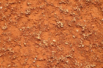 Dry red crushed bricks surface on tennis court