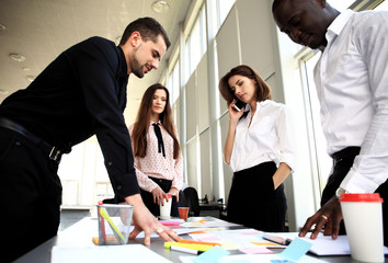 Image of business partners discussing documents and ideas