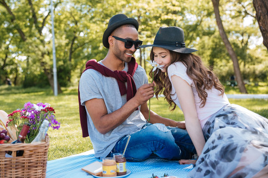 Beautiful Young Couple Having A Picnic In Park