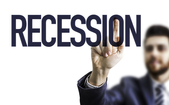 Business man pointing the word: Recession