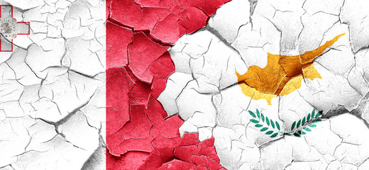 Malta flag with Cyprus flag on a grunge cracked wall