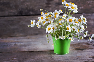 Naklejka na ściany i meble chamomile, daisies bouquet, bouquet of flowers on the old wooden background. Bunch of daisy.