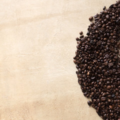 Scattered coffee beans on textured brown table. Top view, copy space - 113535186