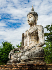 Fototapeta premium Buddha statue at Wat Traphang Ngoen, an ancient temple in Sukhothai Historical Park, Sukhothai, Thailand. 