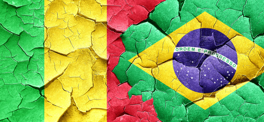 Mali flag with Brazil flag on a grunge cracked wall