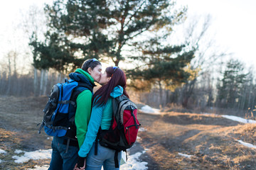 Naklejka na ściany i meble Hiking couple in spring forest.