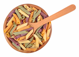 Colored uncooked italian pasta penne in a wooden bowl on a white