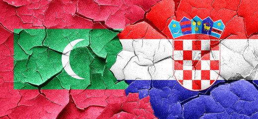 Maldives flag with Croatia flag on a grunge cracked wall