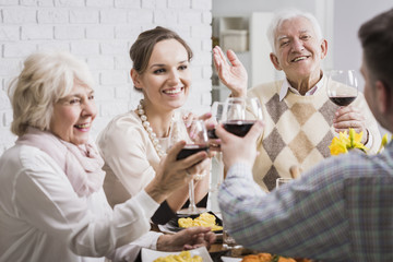 Family making a toast at dinner