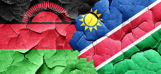 Malawi flag with Namibia flag on a grunge cracked wall