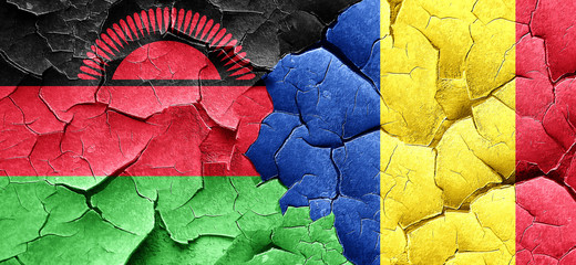 Malawi flag with Romania flag on a grunge cracked wall