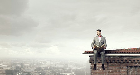 Fototapeta premium Businessman reading old book