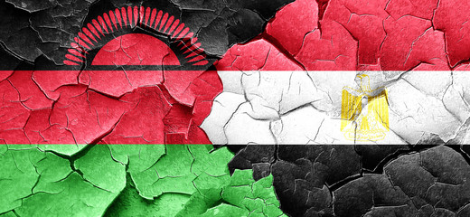 Malawi flag with egypt flag on a grunge cracked wall
