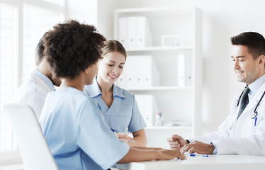 Fototapeta premium group of happy doctors meeting at hospital office