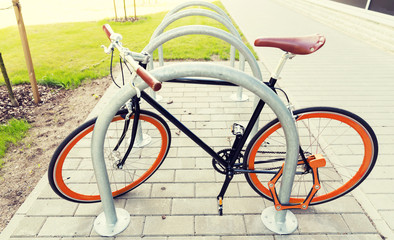 Fototapeta na wymiar close up of bicycle locked at street parking