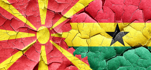 Macedonia flag with Ghana flag on a grunge cracked wall