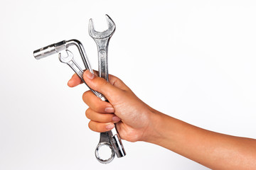 Boy hand holding a wrench isolated on a white. Holding Wrench or Spanner.