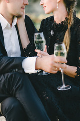 young couple drinking champagne from nice glasses