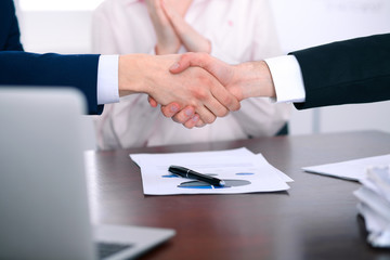 Business people shaking hands finishing up a meeting